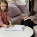 CHILD DOING THERAPY SESSION WITH PSYCHOLOGIST