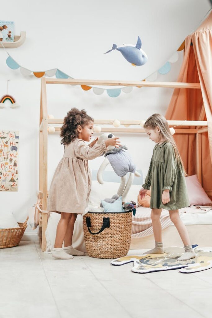 GIRLS PLAYING WITH STUFFED TOYS